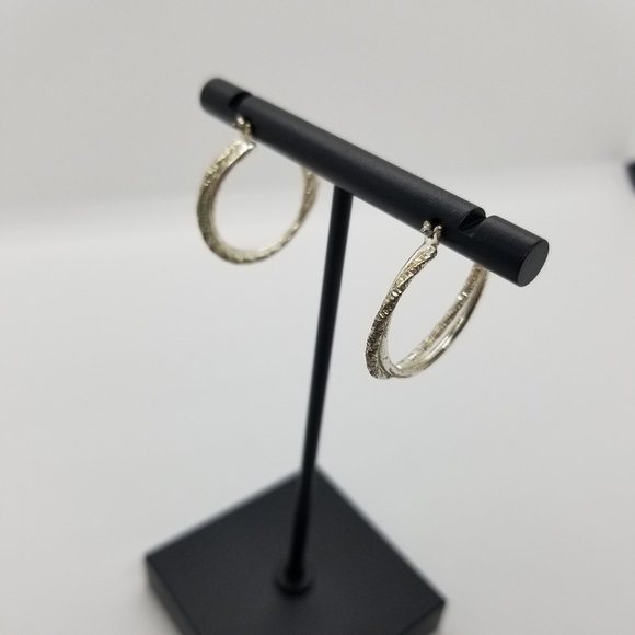 silver tone textured twist hoop earrings - Picture 2 of 2